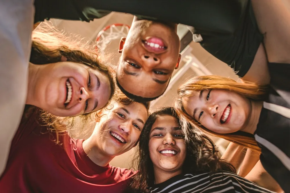 A group of smiling students together outdoors